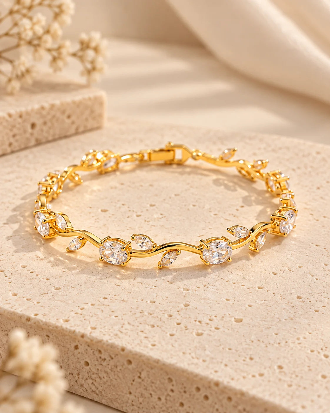 Gold-tone rhinestone bracelet with oval and round stones on display
