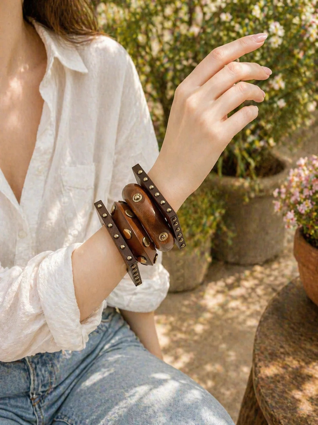 Studded leather kada bracelet stack with metal studs and clasp details
